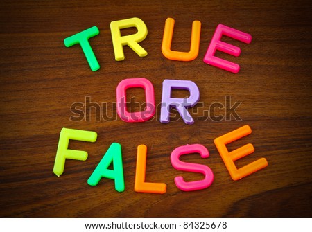 True or false in colorful toy letters on wood background