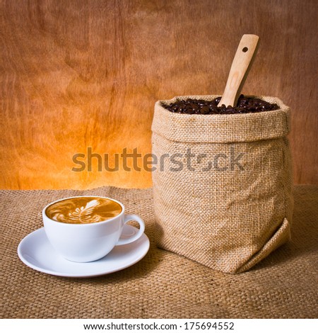 Cafe Latte And Coffee Beans In Burlap