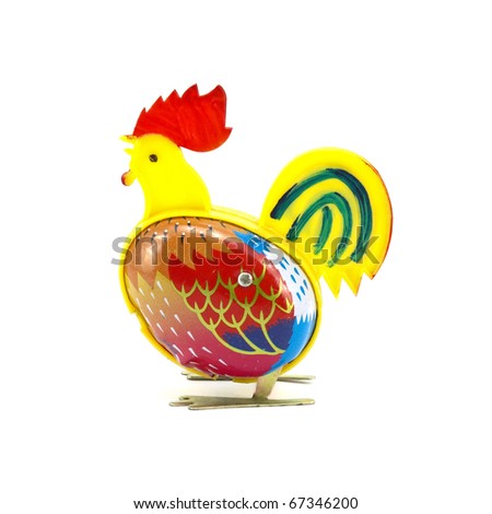 antique tin toy chicken isolated on white background