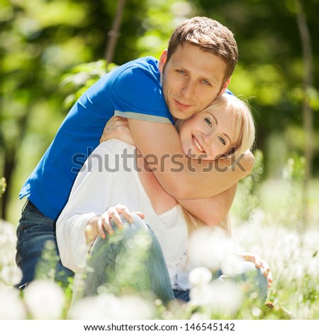 Young happy couple in the park