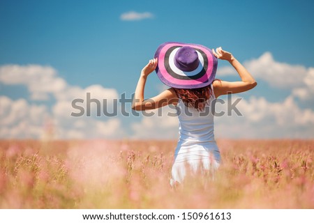 Woman in the field with flowers