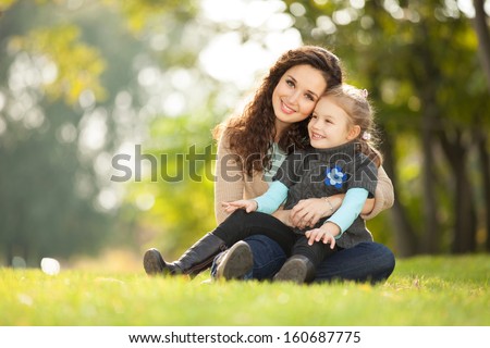 Mother and daughter in the park Mother and daughter in the park