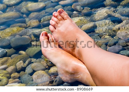 woman feet relax in the beach