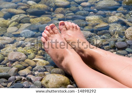 woman feet relax in the beach
