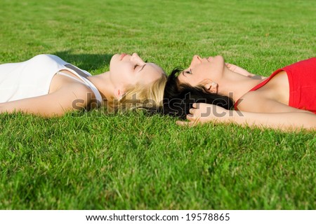 sweet women rest on the grass