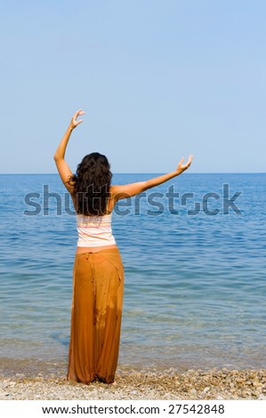 happy young woman dance in the beach