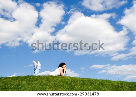 pretty woman rest on the green grass