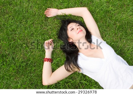 sweet woman rest on the green grass