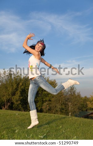 fashion woman jump in the park