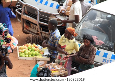 KAMPALA, UGANDA - SEPTEMBER 28, 2012.  Multiple vendors work in and around the Kampala bus station selling their different merchandise in Kampala, Uganda on September 28,2012.
