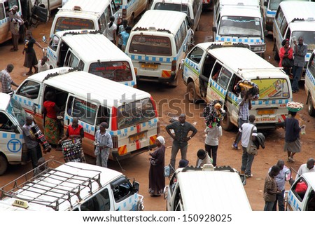 KAMPALA UGANDA SEPTEMBER 28 2012 Ugandans move about through the taxi park in downtown Kampala Uganda on September 28 2012 KAMPALA UGANDA SEPTEMBER 28 2012 Ugandans move about through the taxi park in downtown Kampala Uganda on September 28 2012