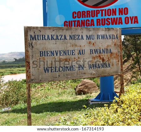 RUSUMO, RWANDA - SEPTEMBER 19, 2012. The welcome to Rwanda sign at the border crossing into Rwanda from Tanzania at Rusumo.