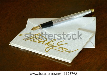 A thank you note with a fountain pen on the image