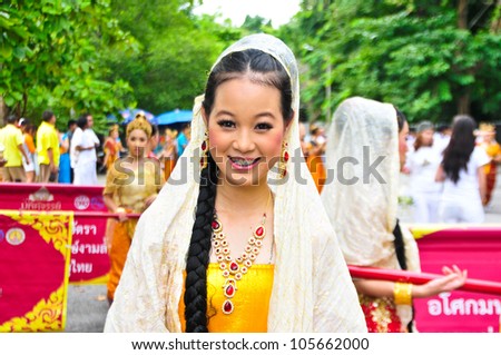 NAKHON PATHOM,THAILAND - JUNE 4: Unidentified Thai girls in traditional dress in Visakha Bucha day to show respect and faith,4 June 2012 at Nakhon Pathom,Thailand.