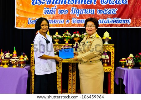 NAKHON PATHOM,THAILAND-JUNE 28 : Female students received certificates from the teacher in traditionally of Respect Teacher Day, 28 June 2012 at Nakhon Pathom,Thailand.