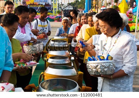 YASOTHON,THAILAND-FEB 17: unidentified people shared food offerings in \