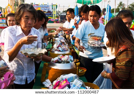 YASOTHON,THAILAND-FEB 17: unidentified people shared food offerings in 