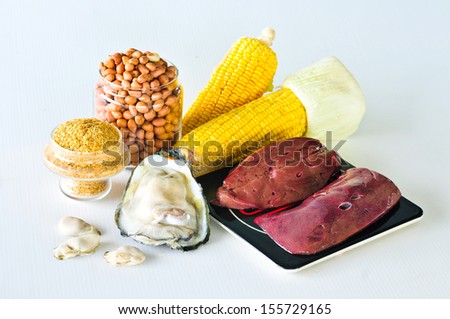 Variety of foods with Zinc (minerals) isolated on white