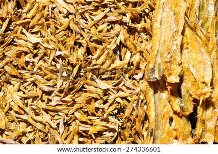Dried small fish on asian fish market for background
