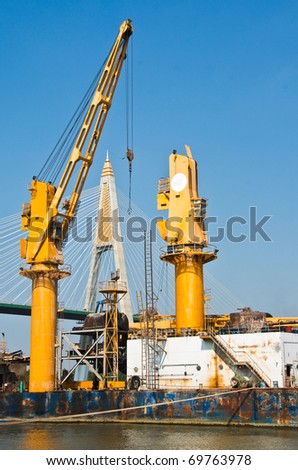 tall yellow lifting crane  for transportation