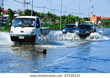 BANGKOK, THAILAND - OCTOBER 31: Flood through the streets of the city during the worst monsoon flood. October 31, 2011 in Bangkok, Thailand.