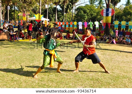 SUKHOTHAI,THAILAND-JAN 17:Unidentified actors perform at the ancient battle and defense play on The King Ramkhamhaeng the Great Day,On Jan 17,2011 in Sukhothai Historical Park.Thailand.