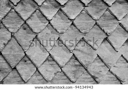 Zig zag lines of the roof made ??of wood, Natural textured background Black and white image.