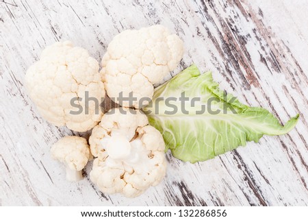 Luxurious cauliflower background, rustic style, top view. Culinary vegetarian & vegan raw food diet.