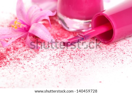 Pink nail polish close up, ground foundation and make up with pink blossom isolated on white background. Girly fashion in pink and white.