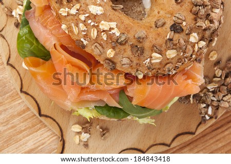 Delicious bagel eating. Fresh baked bagel with smoked salmon top view. American eating.