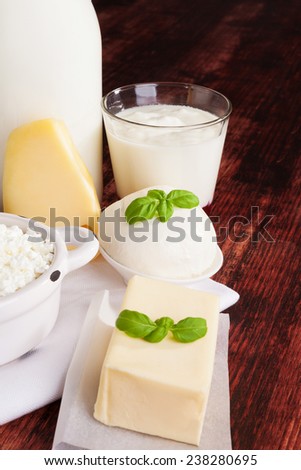 Dairy products milk, cheese, yogurt and curd on dark wooden background. Culinary healthy dairy products.