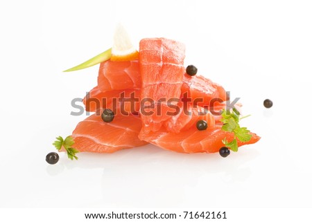 Sashimi sushi. Raw salmon pieces arranged on white background.