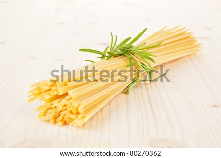 Traditional italian pasta. Spaghetti on wooden table.