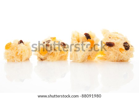 Luxurious panettone pieces isolated on white background. Festive food background.