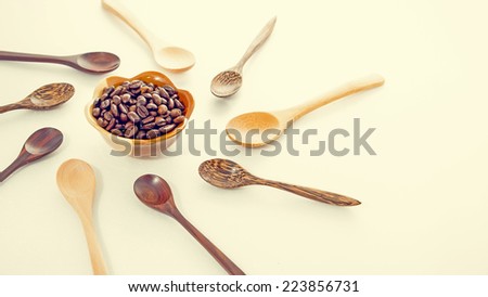 Roasted coffee beans with wood spoons
