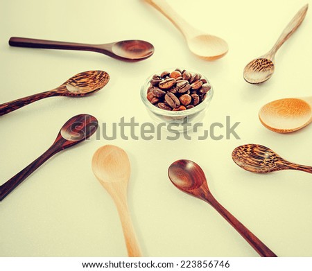 Roasted coffee beans with wood spoons