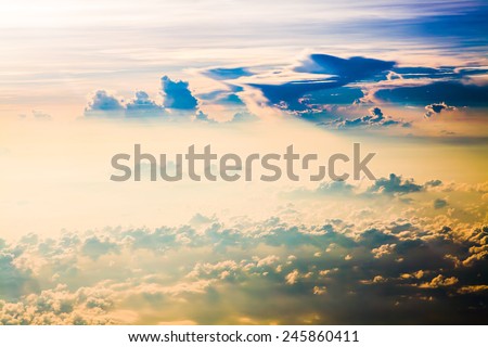 Clouds. sky with clouds at sunset or sunrise. above from airplane over the ocean.