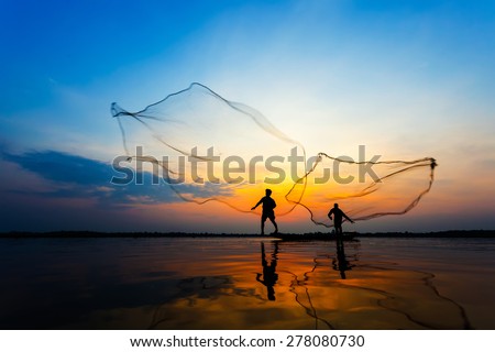 Fishermans in action when fishing at sunrise, wanon Niwat, Sakon Nakhon, Thailand.