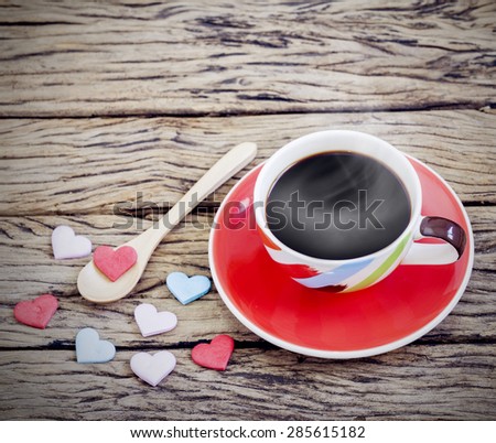 Black coffee in colorful cup with hearts.Coffee menu background