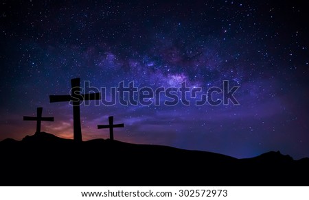 cross silhouette on mountain with milky way in the sky. Conceptual scene.