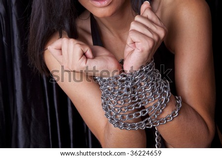 Attravtiv Woman Arms In Chains