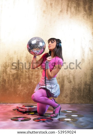 Disco Girls with Glitter Ball and Headphones In Night Club
