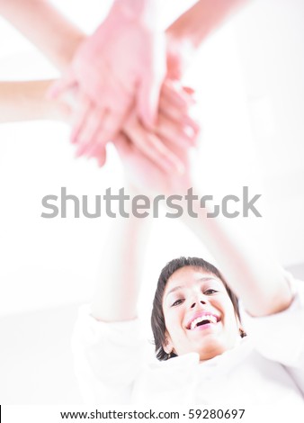 Business team join hands on white background