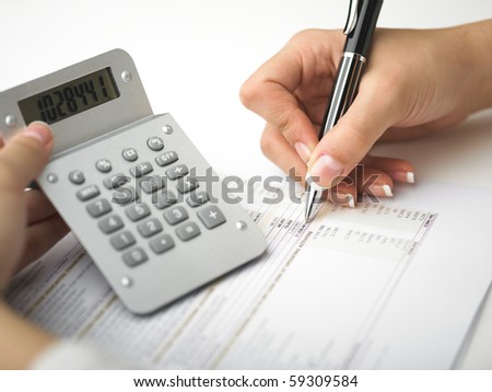Market Analyze - pen and calculator on papers
