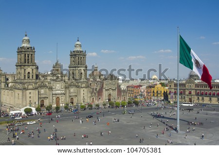the zocalo in mexico city, with the cathedral and giant flag in the centre