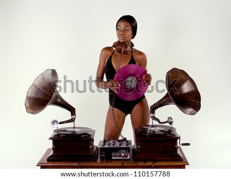sexy young woman djs using two retro antique gramophones. cool and quirky concept clip