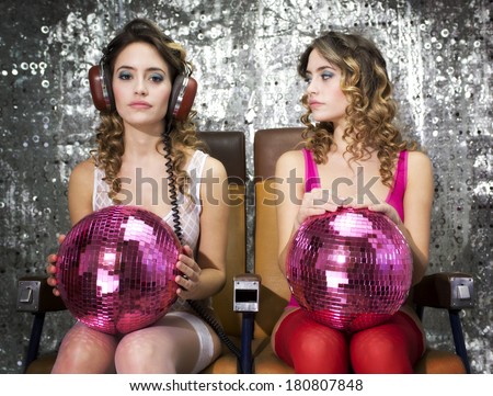 fantastic conceptual image of a beautiful sexy disco woman filmed twice interacting with herself. Perfect for stylish club, disco and fashion events