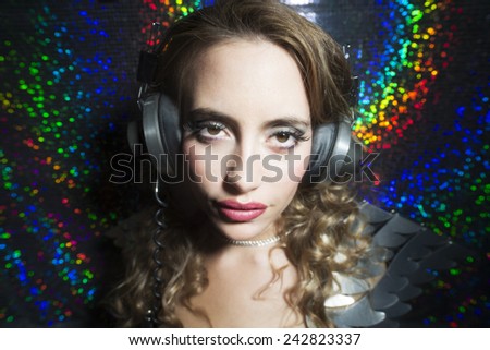 beautiful sexy disco dj woman in silver costume. Perfect for stylish club, disco and fashion events
