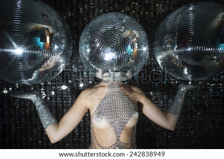 stunning sexy disco woman with a mirror ball for a head