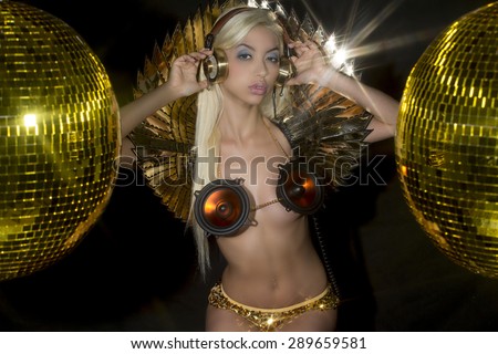 beautiful sexy gold disco woman with a speaker bra surrounded by discoballs. Perfect for stylish club, disco and fashion events
